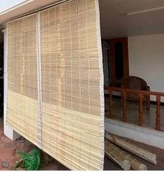 an outside view of a house with bamboo blinds