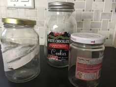 two jars filled with ice sitting on top of a counter