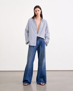 FLORA TROUSER JEAN | Nili Lotan Relaxed Fit Denim Blue Flare Jeans For Work, Relaxed Fit Wide Leg Jeans With Welt Pockets, Relaxed Fit Wide-leg Jeans With Welt Pockets, Workwear Flare Jeans With Five Pockets, Chic Relaxed Fit Jeans With Patch Pockets, Uzun Boy, Pleated Jeans, Androgynous Style, Tom Boy