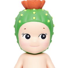 a small toy with a green hat on it's head and eyes, sitting in front of a white background