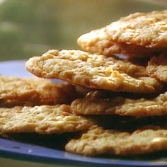 a blue plate topped with cookies on top of a table