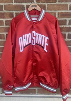 Head to the game in style with this Ohio State Buckeyes Red Lightweight Satin Track Jacket! Show off your Buckeyes pride in this Athletic Jacket, which features a embroidered tackle twill team wordmark on front chest. Go Buckeyes! Long Sleeve Outerwear For Game Day In Winter, Long Sleeve Winter Outerwear For Game Day, Casual Fall Outerwear For Game Day, Winter Game Day Long Sleeve Outerwear, Team Spirit Track Jacket For Fall Sports Events, Red Hooded Track Jacket For College, Collegiate Style Track Jacket For Fall Sports Events, Sporty University Red Outerwear For Fall, Casual University Red Track Jacket For Streetwear