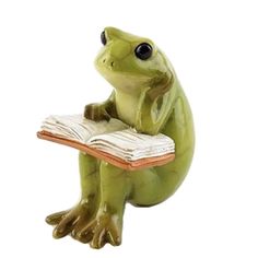 a frog sitting on its hind legs reading a book