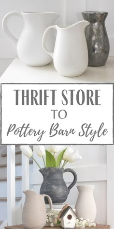 three white vases sitting on top of a table next to a sign that says thrift store to pottery barn style