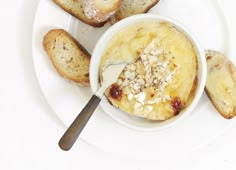 a white plate topped with bread and pudding