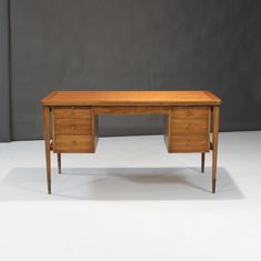 a wooden desk with two drawers on one side and an open drawer on the other