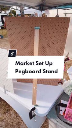 a market set up with pegboard stand