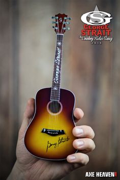 a person holding an acoustic guitar with the caption, george stratt i always wants to play