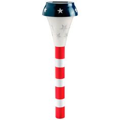 a red, white and blue toothbrush holder with stars on it's top