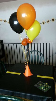 some balloons are sitting on top of a table