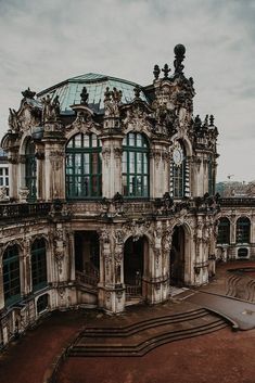 an old building with lots of windows and a skateboard ramp in front of it