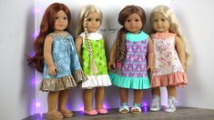 three dolls are standing next to each other