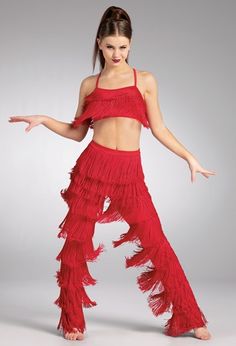 a woman in a red outfit is dancing