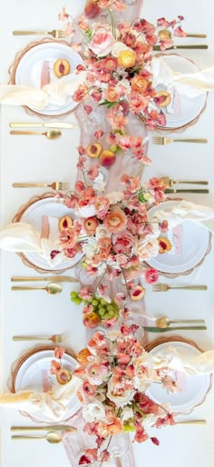 the table is decorated with flowers and plates