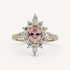 a pink diamond ring with two white diamonds on the band and an oval cut stone in the center