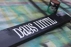 there is a sign that says davis street next to a can of paint on the table