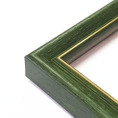 a close up of a green frame on a white surface with a gold border around the edge