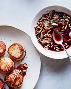 some food is sitting on a plate next to a bowl