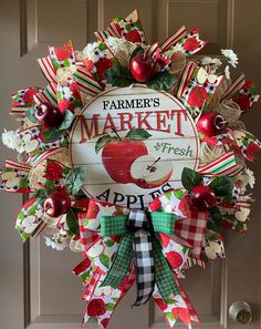 a farmers market apple wreath hanging on the front door