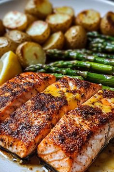 grilled salmon and asparagus on a plate with potatoes