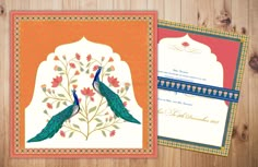 wedding cards with peacocks on the front and back, decorated with flowers and leaves