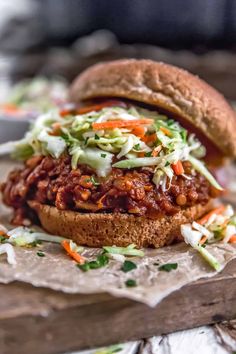 a sloppy joe sandwich with lettuce and carrots