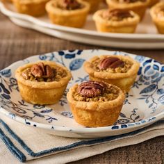 small pecan pies on a blue and white plate