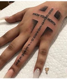 a woman's hand with a cross on it and words written in black ink