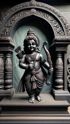 a statue of a hindu god holding a snake