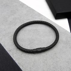 Our new men's personalised single or double slim leather bracelet now with a black matt clasp is a must have gift accessory for him, whether you are buying for yourself or a loved one. Create a custom monogrammed and stylish jewellery accessory that will stand out due to its sleek minimal design and durable quality genuine woven leather. Our bracelets come in 4 colours black, brown, grey and navy in sizes to fit either 19cm and 21cm wrists. PLEASE NOTE - We are currently unable to include gift m 3rd Wedding Anniversary, Jewelry Mens, Clasp Bracelet, Bracelet Men, Sleek Style, Men Jewelry, Black Gift Boxes, Bracelet Clasps, Braided Bracelets