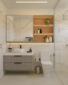 a bathroom with a toilet, sink and mirror in it's centerpieces