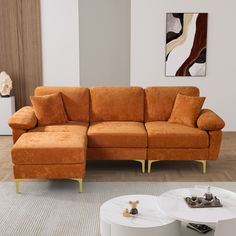 a living room with a sectional couch and coffee table