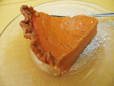 a piece of pie sitting on top of a glass plate