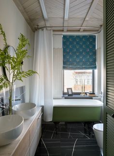 a bathroom with two sinks and a bathtub