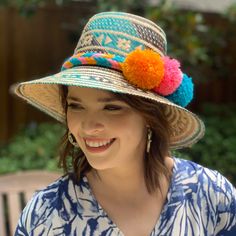 Handwoven Turquoise, Brown And Natural Straw Hat With A Wide Brim And Interior Band. Each Of Our Artisan Hats Is Unique And Takes Approximately 8-10 Hours To Hand Weave By Skilled Artisans In The Guajira Desert Of Colombia. Pair With One Of Our Handwoven Pom-Pom Hat Bands For A Fun Pop Of Color. Pom Pom Hat Bands Are Available In A Variety Of Colors And Are Sold Separately. Comment Below If You're Interested In Purchasing A Pom Pom Hat Band And We Will Let You Know What Colors We Have Available. Multicolor Woven Straw Hat For Vacation, Multicolor Woven Hats For Spring, Spring Multicolor Woven Hats, Multicolor Woven Hat For Vacation, Woven Multicolor Hats For Vacation, Handmade Panama Hat For Festivals, Bohemian Green Hat For Vacation, Green Bohemian Hat For Vacation, Blue Flat Brim Sun Hat For Festival