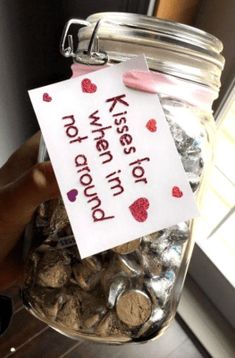 a jar filled with lots of coins and a sign that says, no water needed to drink