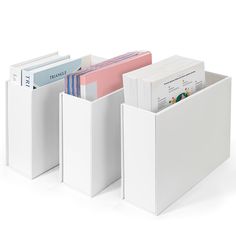 three white file folders stacked on top of each other next to each other with files in them