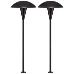 two black floor lamps sitting next to each other on top of a white background,