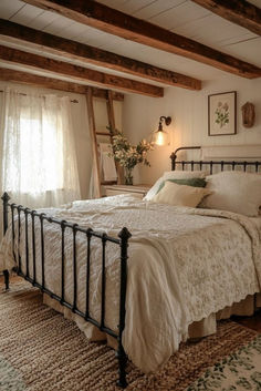 a bed with white sheets and pillows in a room