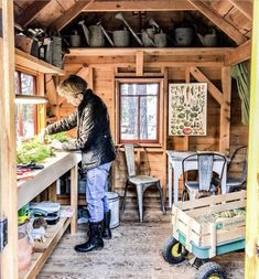 an instagram photo of a man working in his tiny cabin