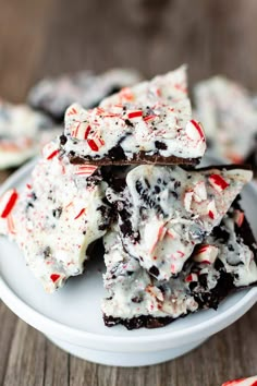 white chocolate peppermint barkies on a plate with candy canes around them