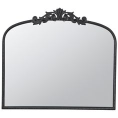 an ornate black metal frame mirror on a white background