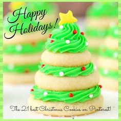 a christmas tree made out of cookies with green frosting on it and the words happy holidays