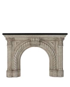 an antique fireplace mantel with a stone arch and black marble top, isolated against a white background