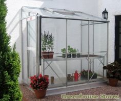 a greenhouse with potted plants in it