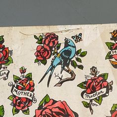 a piece of paper with roses and birds on it