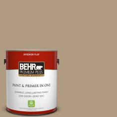 a can of behr paint on a gray background