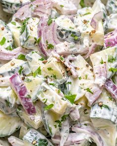 a salad with onions, cheese and herbs