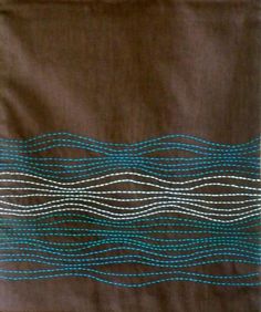 an image of a piece of cloth with blue and white lines on it