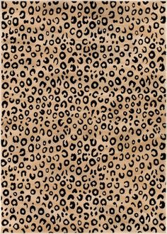 an animal print rug with black and white spots